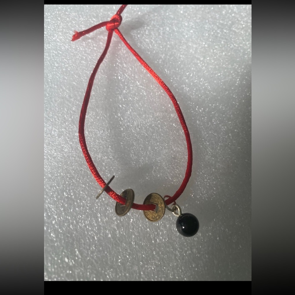 Red String Bracelet with Gold and Black Accents